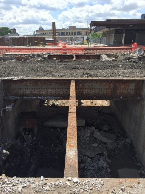 Top of the mail tunnel removed. Photo is taken from between the tracks facing south with the post office in the background. 6-26-15 [PHOTO: NYSDOT]