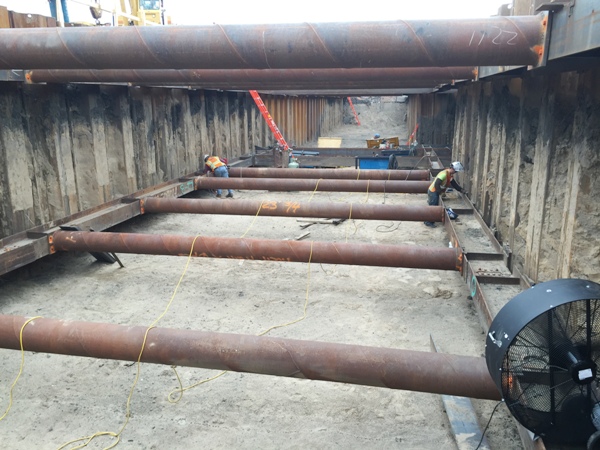 Platform sheeting and shoring bottom horizontal support installation looking East. 8-3-15 [PHOTO: NYSDOT]